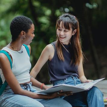 2 students looking up information