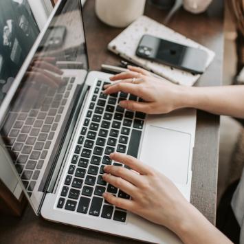 Hands using a laptop